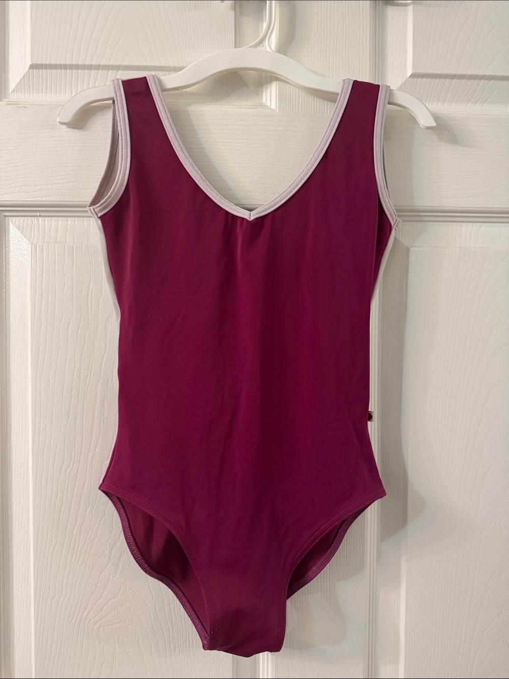 Yumiko Gina leotard. Burgundy color with pink trim. Burst lining.Size: M